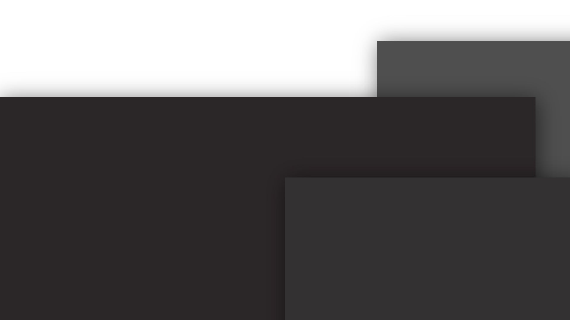 Three overlapping rectangles in dark shades of gray appear against a white background. The rectangles are arranged at different heights, creating a layered effect. A soft shadow is visible behind the top rectangle.