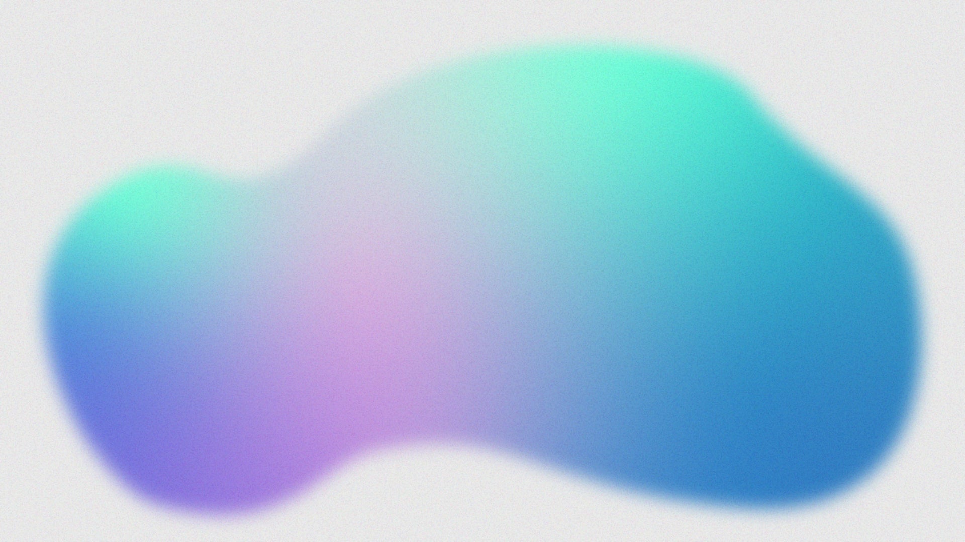 A smooth, amorphous blob with a gradient blending purple, blue, and aqua colors on a light gray background. The edges of the shape are soft and slightly blurred.