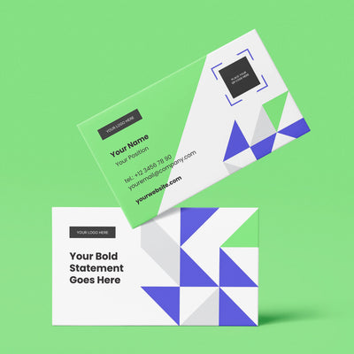 Two business cards from the Forma 40 Collection by More By Us | The Brand Store rest on green. This Canva template features blue and purple geometric shapes, with editable sections for your logo, website, name, title, and contact info.